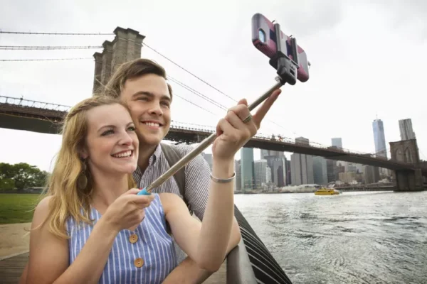 couple using selfie stick 5c2d7cf0c9e77c000167c9d0